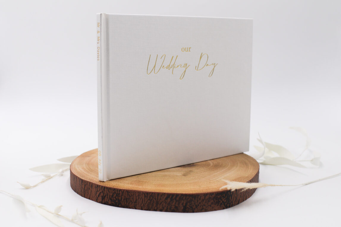 Wedding book showing 'Our Wedding Day' in foil with txt on the spine